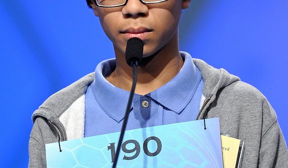 Joseph Delamerced, 13, of Cincinnati, Oh., spells &quot;malleolus&quot; during the semifinal round of the Scripps National Spelling Bee in Oxon Hill, Md., Thursday, May 30, 2013. (AP Photo/Cliff Owen)