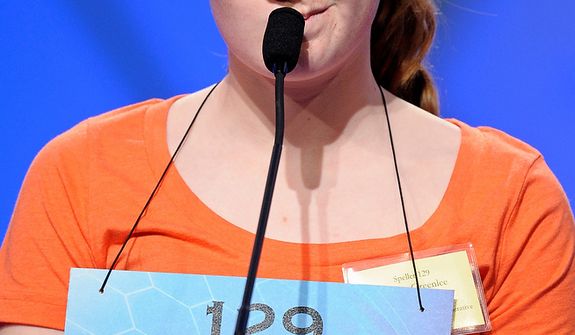 Emma Greenlee, 14 of Aurora, Minn., spells &quot;joculator&quot; during the semifinal round of the Scripps National Spelling Bee in Oxon Hill, Md., Thursday, May 30, 2013. (AP Photo/Cliff Owen)