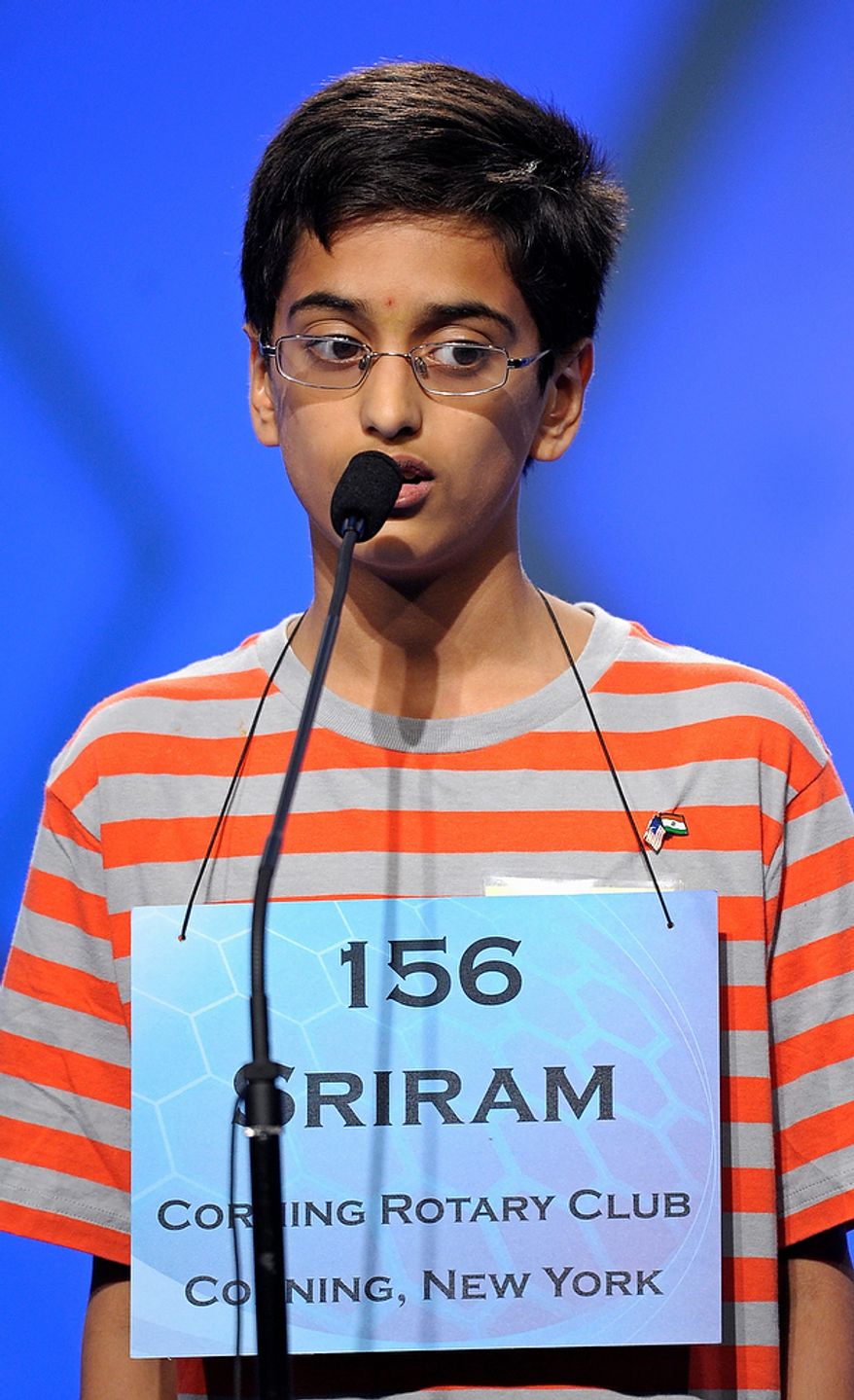 Sriram Hathwar, 13 of Painted Post, N.Y., spells "flaneur" during the semifinal round of the Scripps National Spelling Bee in Oxon Hill, Md., Thursday, May 30, 2013. (AP Photo/Cliff Owen)