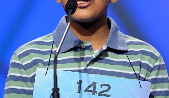 Gokul Venkatachalam, 12, of Chesterfield, Mo.,  spells &quot;smellfungus&quot; during the semifinal round of the Scripps National Spelling Bee in Oxon Hill, Md., Thursday, May 30, 2013. (AP Photo/Cliff Owen)