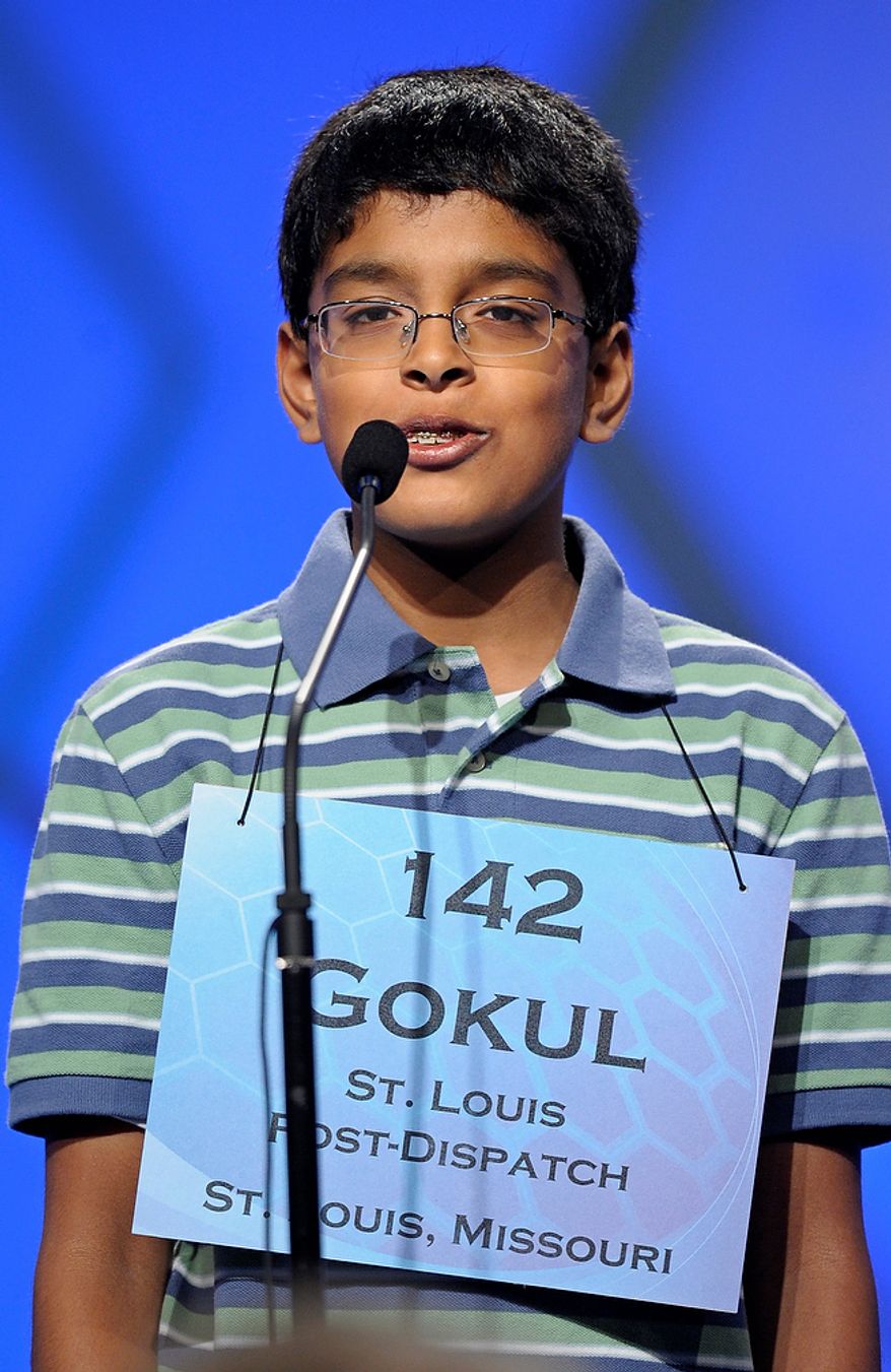 Gokul Venkatachalam, 12, of Chesterfield, Mo., spells "smellfungus" during the semifinal round of the Scripps National Spelling Bee in Oxon Hill, Md., Thursday, May 30, 2013. (AP Photo/Cliff Owen)
