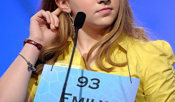Emily Keaton, 14, of Pikeville, Ky., spells &quot;encephalitis&quot; during the semifinal round of the Scripps National Spelling Bee in Oxon Hill, Md., Thursday, May 30, 2013. (AP Photo/Cliff Owen)