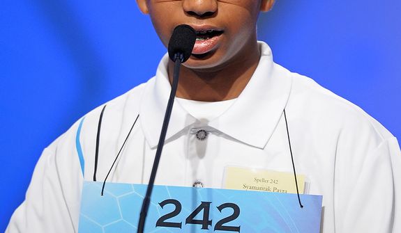 Syamantak Payra, 12, of Friendswood, Texas, spells &quot;hepatectomy&quot; during the semifinal round of the Scripps National Spelling Bee in Oxon Hill, Md., Thursday, May 30, 2013. (AP Photo/Cliff Owen)