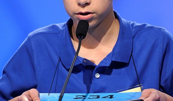 Jonathan Caldwell, 13, of Hendersonville, Tenn., spells &quot;persiflage&quot; during the semifinal round of the Scripps National Spelling Bee in Oxon Hill, Md., Thursday, May 30, 2013. (AP Photo/Cliff Owen)
