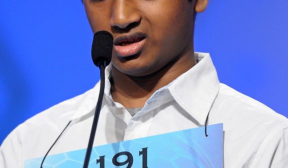 Ashwin Veeramani, 13, of North Royalton, Ohio, incorrectly spells &quot;amimia&quot; during the semifinal round of the Scripps National Spelling Bee in Oxon Hill, Md., Thursday, May 30, 2013. (AP Photo/Cliff Owen)