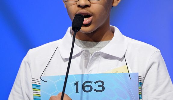 Arvind Mahankali, 13, of Bayside Hills, N.Y., spells &quot;intravasation&quot; during the semifinal round of the Scripps National Spelling Bee in Oxon Hill, Md., Thursday, May 30, 2013. (AP Photo/Cliff Owen)