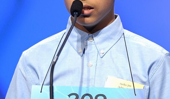 Aditya Rao, 13, of Phillipsburg, N.J., spells &quot;tatterdemalion&quot; during the semifinal round of the Scripps National Spelling Bee in Oxon Hill, Md., Thursday, May 30, 2013. (AP Photo/Cliff Owen)