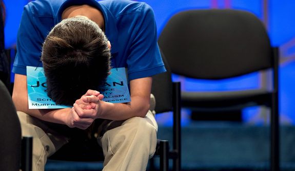 Jonathan Caldwell, 13, of Hendersonville, Tenn., waits for his turn during the semifinal round of the National Spelling Bee on Thursday, May 30, 2013, in Oxon Hill, Md. (AP Photo/Evan Vucci)