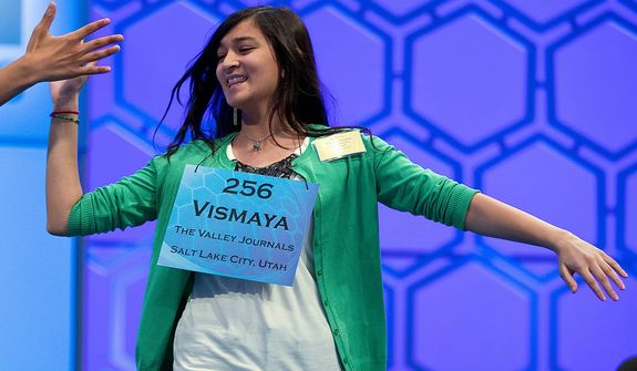 Vismaya Kharkar, 14, of Bountiful, Utah, celebrates after learning that she made the finals of the National Spelling Bee on Thursday, May 30, 2013, in Oxon Hill, Md. (AP Photo/Evan Vucci)