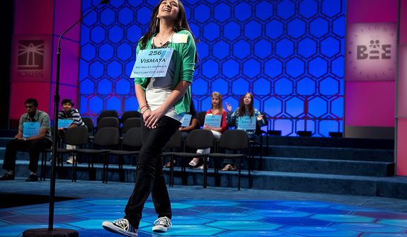 Vismaya Kharkar, 14, of Bountiful, Utah, reacts after spelling the word &quot;agelicism&quot; correctly during the semifinal round of the National Spelling Bee on Thursday, May 30, 2013, in Oxon Hill, Md. (AP Photo/Evan Vucci)
