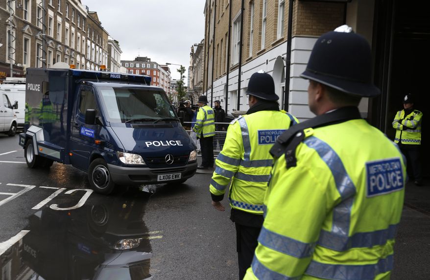 A police van believed to be transporting 22-year-old Michael Adebowale, a suspect in the murder of British soldier Lee Rigby, arrives at Westminster Magistrates Court in central London, Thursday, May 30, 2013. Two men attacked and killed the off-duty soldier in broad daylight, in southeast London's Woolwich area on Wednesday, May 22. They were shot by police and arrested on suspicion of murder. (AP Photo/Lefteris Pitarakis)