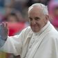 Pope Francis waves in St. Peter&#39;s Square at the Vatican as he leaves at the end of his weekly general audience on Wednesday, May 29, 2013. (AP Photo/Andrew Medichini)