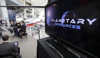 **FILE** Officials with Planetary Resources, an asteroid mining company based in Bellevue, Wash., talk to reporters May 29, 2013, in Seattle about their plans for the world&#39;s first crowd funded space telescope. (Associated Press
