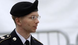 ** FILE ** Army Pfc. Bradley Manning is escorted into a courthouse at Fort Meade, Md., before a pretrial military hearing on Tuesday, May 21, 2013. (AP Photo/Patrick Semansky)