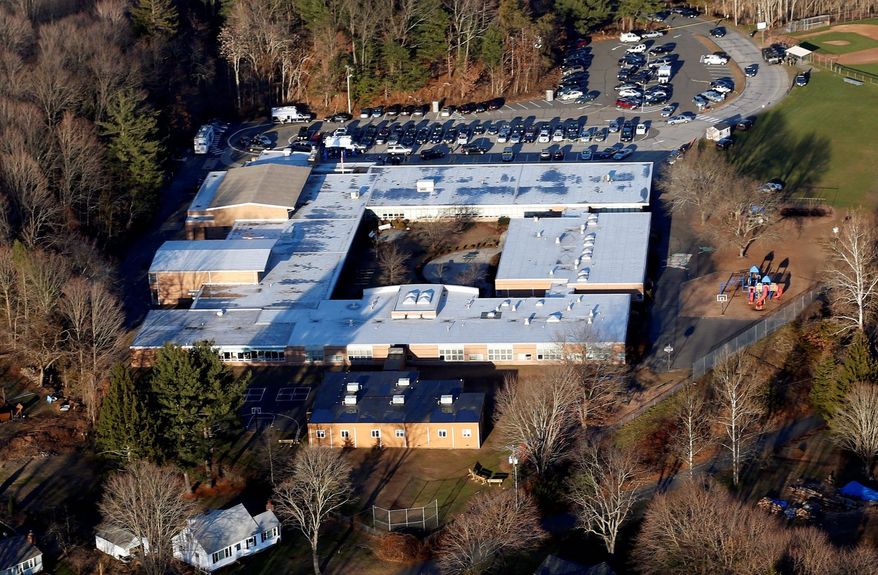 Sandy Hook Elementary School in Newtown, Conn., will be torn down and a new school built on the land after 26 people were killed there in December. At Virginia Tech, however, Norris Hall still stands and is used for research and classes. Specialists say it's up to each community to decide what's best.
(Associated Press)