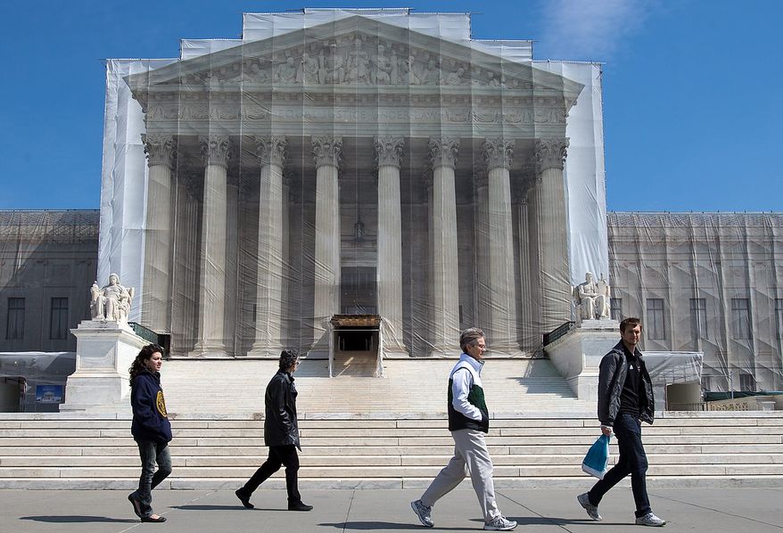 ** FILE ** Visitors walk past the Supreme Court in Washington on Saturday, March 23, 2013. (AP Photo/Jacquelyn Martin)