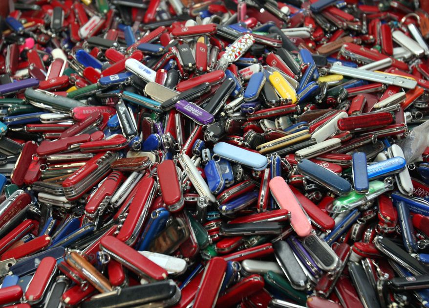 **FILE** Knives of all sizes and types are piled in a box at the State of Georgia Surplus Property Division store in Tucker, Ga., on Sept. 26, 2006, and are just a few of the hundreds of items discarded at the security checkpoints of Hartsfield-Jackson Atlanta International Airport that will be for sale at the store. (Associated Press)