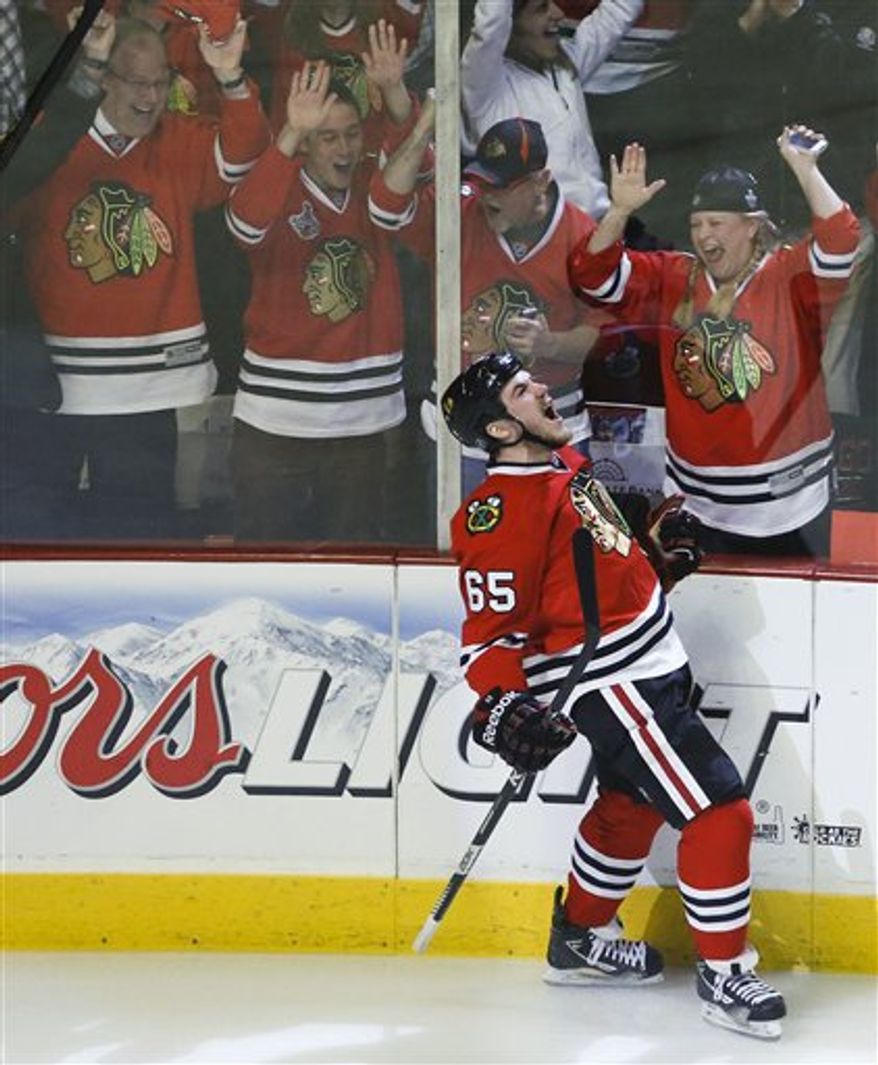 Chicago Blackhawks center Andrew Shaw (65) reacts after scoring a goal against the Los Angeles Kings during the first period in Game 2 of the NHL hockey Stanley Cup Western Conference finals Sunday, June 2, 2013 in Chicago. (AP Photo/Charles Rex Arbogast)