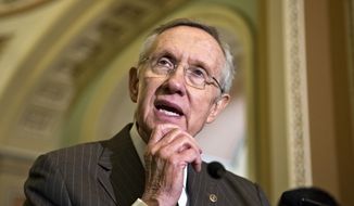 **FILE** Senate Majority Leader Harry Reid, Nevada Republican, speaks with reporters on Capitol Hill in Washington on June 4, 2013, following a Democratic strategy session. (Associated Press)