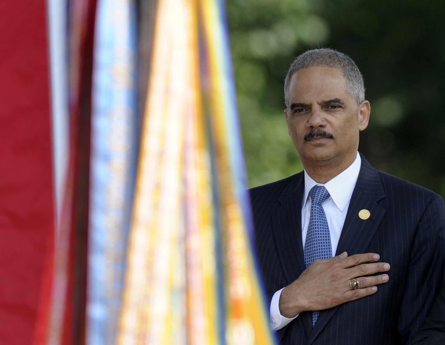 Attorney General Eric Holder attends the 50th anniversary remembrance ceremony for slain civil rights activist Medgar Evers, Wednesday, June 5, 2013, at Arlington National Cemetery in Arlington, Va. (AP Photo/Susan Walsh)