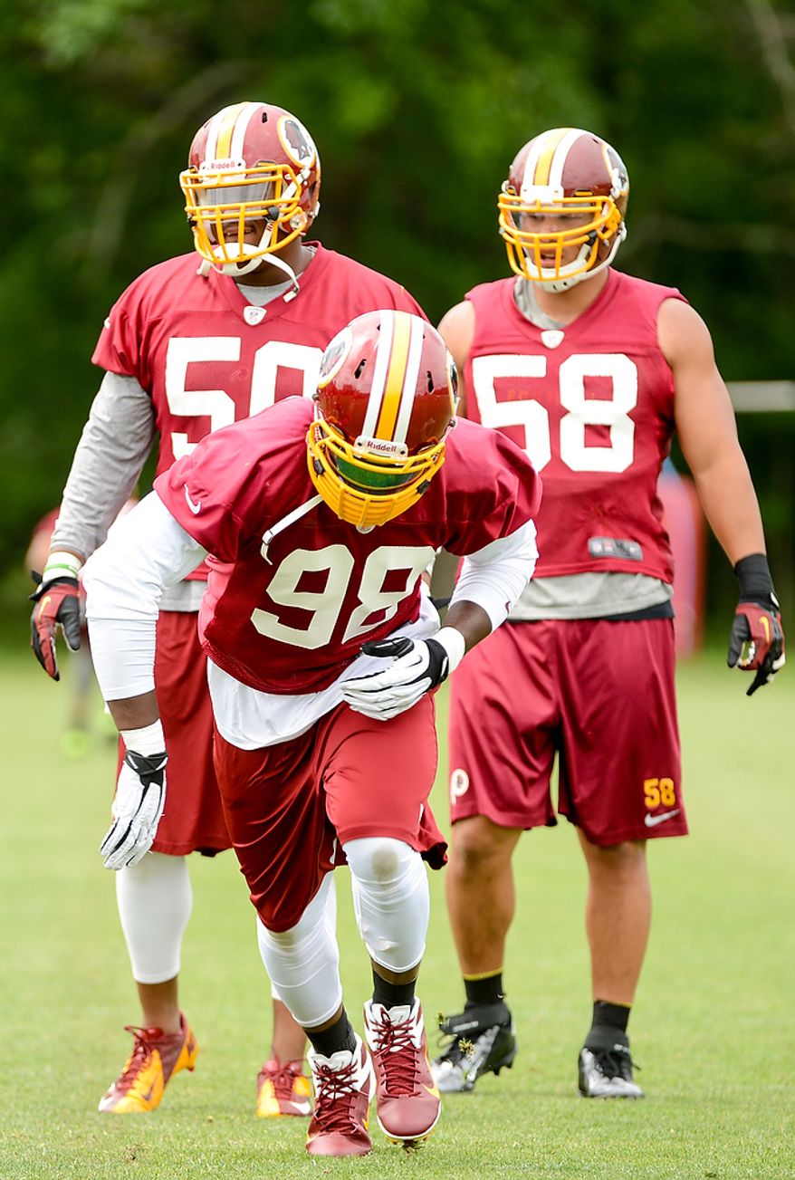 Washington Redskins outside linebacker Brian Orakpo runs a drill during a NFL football organized team activity at Redskins Park, Ashburn, Va., Thursday, June 6, 2013. (Andrew Harnik/The Washington Times)
