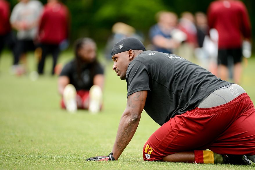 Washington Redskins tight end Fred Davis (83) stretches before practice during a NFL football organized team activity at Redskins Park, Ashburn, Va., Thursday, June 6, 2013. (Andrew Harnik/The Washington Times)
