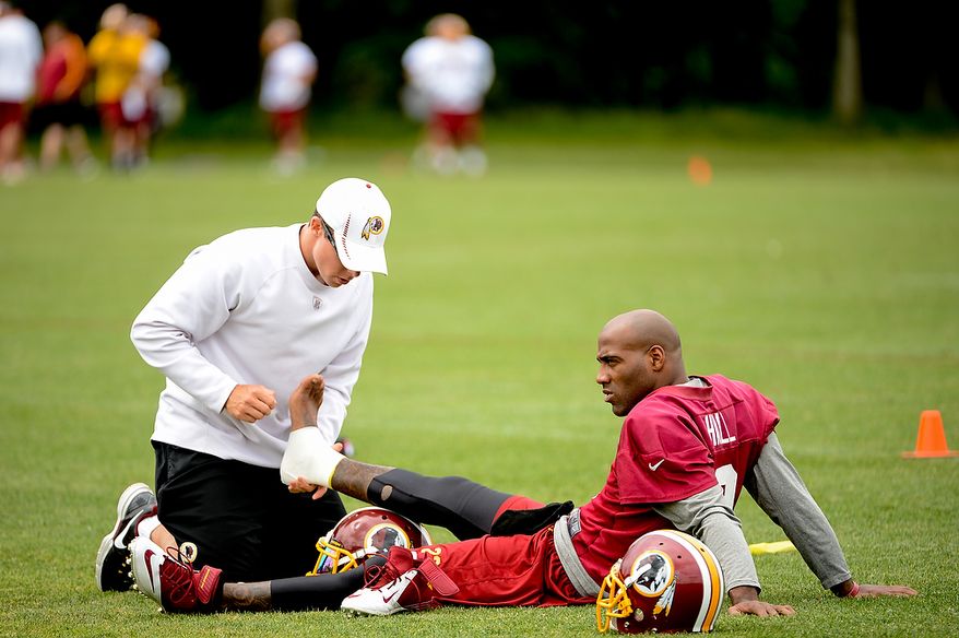 Washington Redskins cornerback DeAngelo Hall (23) gets his foot tapped during a NFL football organized team activity at Redskins Park, Ashburn, Va., Thursday, June 6, 2013. (Andrew Harnik/The Washington Times)