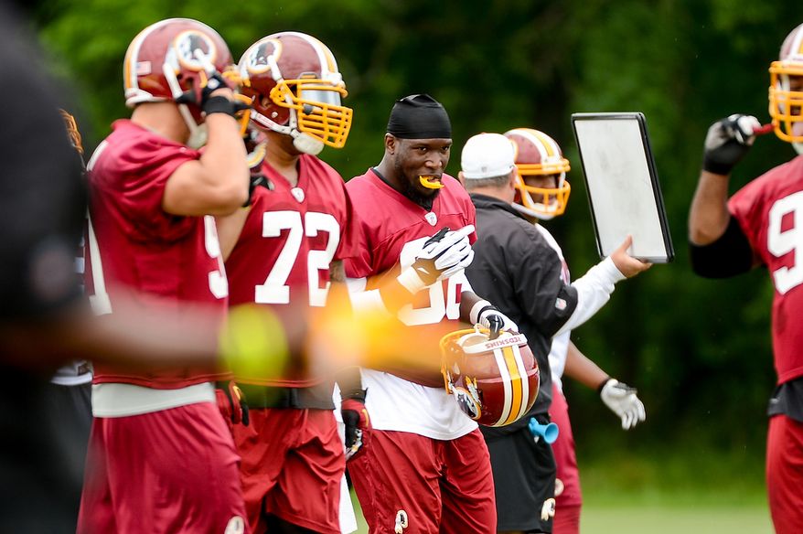 Washington Redskins outside linebacker Brian Orakpo (98), center, during a NFL football organized team activity at Redskins Park, Ashburn, Va., Thursday, June 6, 2013. (Andrew Harnik/The Washington Times)