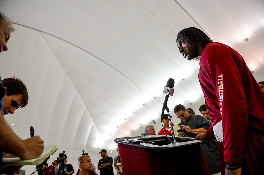 Washington Redskins quarterback Robert Griffin III (10) speaks to reporters at a press conference following a NFL football organized team activity at Redskins Park, Ashburn, Va., Thursday, June 6, 2013. (Andrew Harnik/The Washington Times)