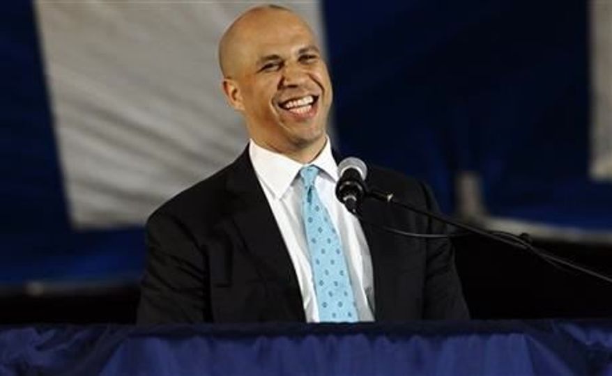 **FILE** Newark Mayor Cory Booker delivers the main address during Class Day for Yale seniors at Yale University in New Haven, Conn., on May 19, 2013. (Associated Press)