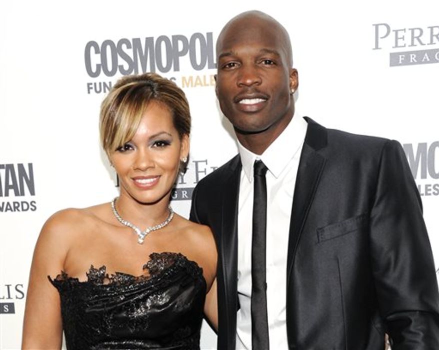 **FILE** This March 7, 2011 file photo shows NFL Football player and reality television star Chad Johnson and Evelyn Lozada attending Cosmopolitan Magazine&#x27;s Fun Fearless Males of 2011 event in New York. Johnson could get jail time for a probation violation stemming from an altercation with his then-wife. The 35-year-old formerly known as Chad Ochocinco pleaded no contest to head-butting Lozada during an argument in August. (AP Photo/Evan Agostini, File)