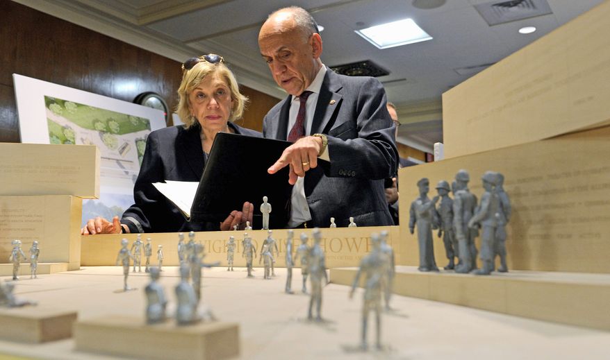 Daniel J. Feil, executive architect of the Eisenhower Memorial Commission, and Susan Banes Harris, who heads the commission's architecture committee, view architect Frank Gehry's model of the controversial Eisenhower Memorial. (Associated Press)