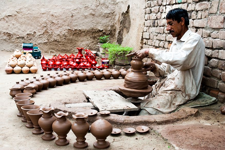 Baseer runs a pottery workshop in Jamrud, Khyber Agency, in FATA. He works on a machine pedaled by his feet. Some of his pots are used for drinking water; others are for kids to collect coins called khazana, treasure, in the local language. To get the money out, the children have to break to pot. Photo / Muhammad Khalid Afridi
