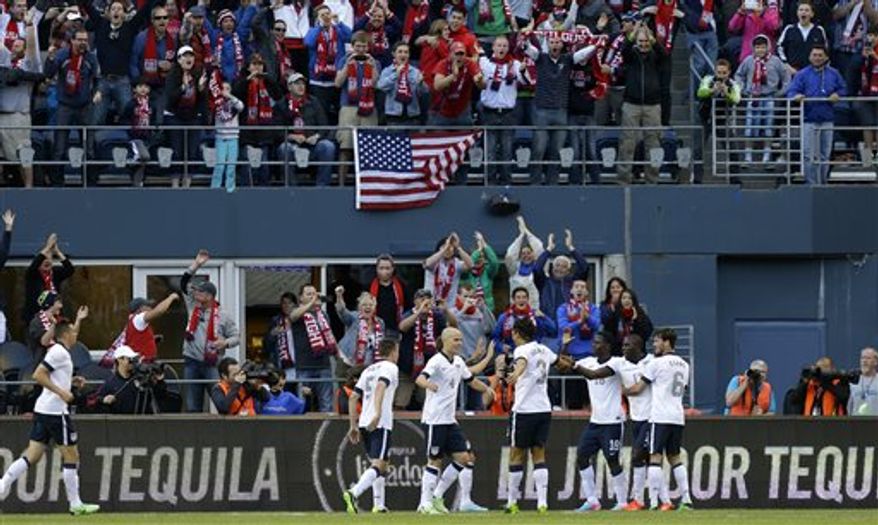 United States&#39; Jozy Altidore, second from right, celebrates with Brad Evans, right, and Eddie Johnson, third from right, and other teammates after Altidore scored a goal against Panama in the first half of a World Cup qualifier soccer match, Tuesday, June 11, 2013, in Seattle. (AP Photo/Ted S. Warren)
