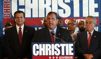 New Jersey Gov. Chris Christie accepts the endorsements of Essex County Executive Joe DiVincenzo, left, and Essex County Sheriff Armando Fontoura at McLoone’s Boat House in West Orange, N.J., Tuesday, June 11, 2013. DiVincenzo and Fontoura were joined by 17 Democratic mayors and pastors endorsing the Republican governor&#39;s re-election bid. (AP Photo/Rich Schultz)