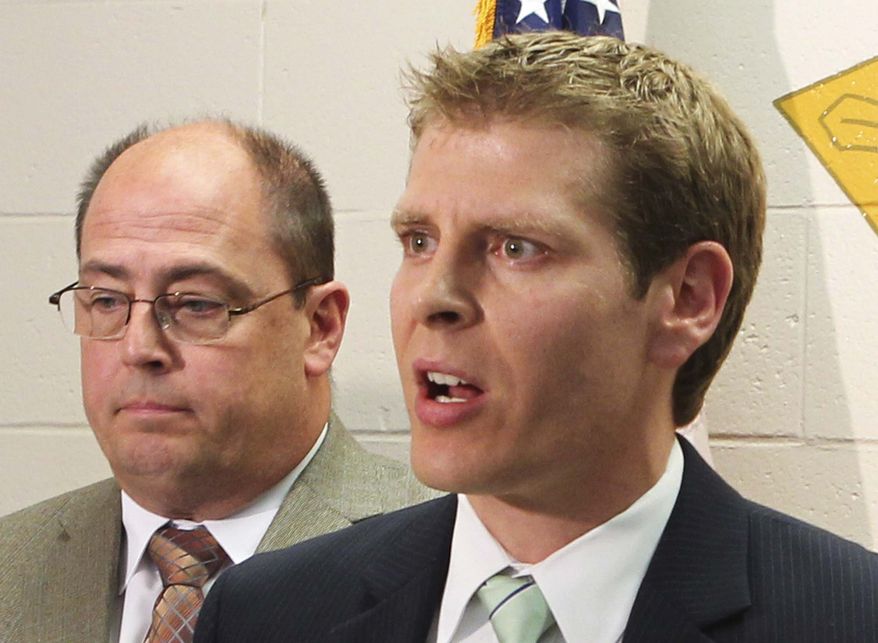 In this May 10, 2013 photo, Randolph County State's Attorney Jeremy Walker speaks at a news conference in Chester, Ill. On Tuesday, June 11, 2013, Walker announced that he will allow the county's citizens to carry concealed guns in public. He is the second southern Illinois prosecutor who is letting his county's residents carry concealed weapons even as Gov. Pat Quinn weighs whether to allow it statewide. (AP Photo/Belleville News-Democrat, Derik Holtmann)