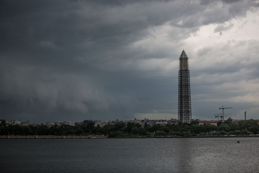A severe storm approaches from northern Virginia, headed towards the National Mall in Washington on Thursday, June 13, 2013. (Andrew S. Geraci/The Washington Times)