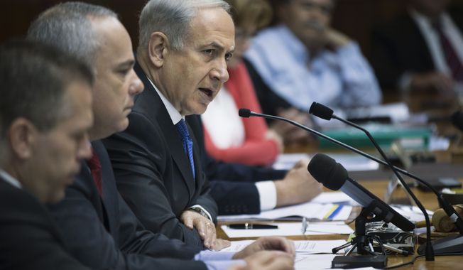 Israeli Prime Minister Benjamin Netanyahu (third from left) chairs at a weekly Cabinet meeting in Jerusalem on Sunday, June 16, 2013. Mr. Netanyahu warned the international community against easing sanctions on Iran following the election of Hasan Rowhani, a reformist-backed presidential candidate, since the country&#x27;s nuclear efforts remain firmly in the hands of Iran&#x27;s extremist ruling clerics. (AP Photo/Uriel Sinai, Pool)