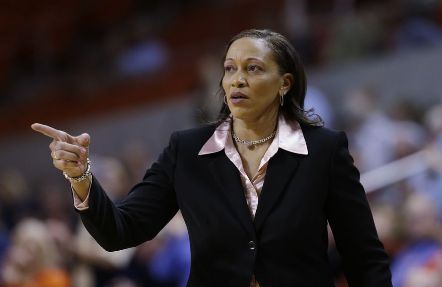 **FILE** In this March 27, 2013, file photo, Auburn head coach Terri Williams-Flournoy directs her team during the second half of an NIT tournament basketball game against Tulane in Auburn, Ala. The former Georgetown coach led the Tigers to a 19-15 record in her first season. Now, she will have seven newcomers in her first full year of recruiting to join three returning starters led by second-team All-Southeastern Conference pick Hasina Muhammad at guard. (AP Photo/Dave Martin, File)