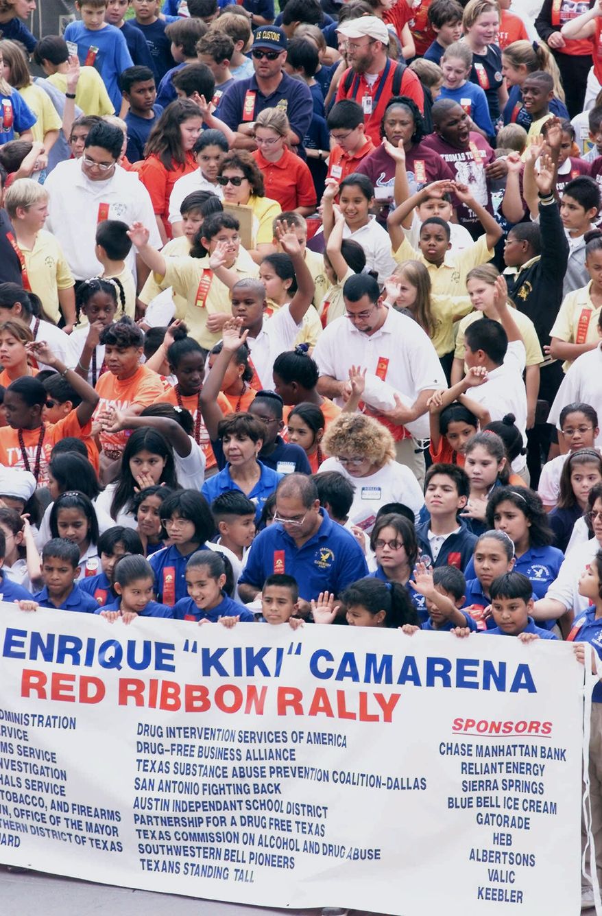 **FILE** Some of the more than 500 Texas fifth- and sixth-grade students are shown during a red-ribbon rally against drug use at the Capitol in Austin on Oct. 19, 2000. Celebrating national Drug Prevention Month, the event also honors the memory of Drug Enforcement Administration agent Enrique "Kiki" Camarena, who was murdered by drug dealers in Mexico in 1985. (Associated Press)
