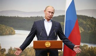 ** FILE ** Russian President Vladimir Putin gestures while speaking during a media conference after a G-8 summit at the Lough Erne golf resort in Enniskillen, Northern Ireland, on Tuesday, June 18, 2013. (Associated Press)