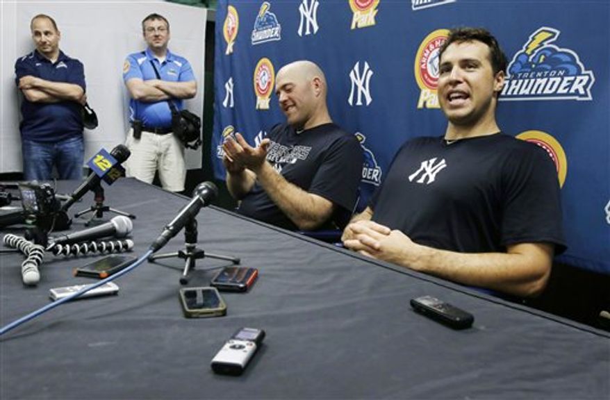 **FILE** New York Yankees general manager Brian Cashman, left, and third baseman Kevin Youkilis, center, listen as first baseman Mark Teixeira, right, answers a question during a news conference in Trenton, N.J., Wednesday, May 29, 2013, after Youkilis and Teixeira played a rehab game with the Trenton Thunder. Teixeira has been sidelined with a right wrist injury since March, and Youkilis has missed nearly 30 games with a back injury. (AP Photo/Mel Evans)