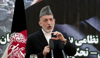 ** FILE ** Afghan President Hamid Karzai speaks at a press conference during a ceremony at a military academy on the outskirts of Kabul, Afghanistan, Tuesday, June 18, 2013. (AP Photo/Rahmat Gul)