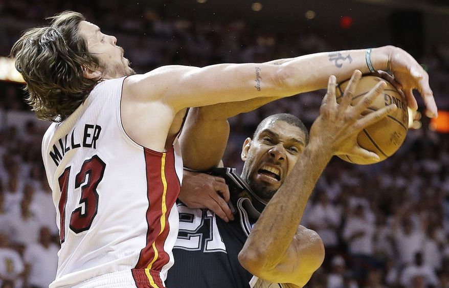 San Antonio Spurs power forward Tim Duncan (21) works as Miami Heat shooting guard Mike Miller (13) defends during the second half of Game 6 of the NBA Finals basketball game, Tuesday, June 18, 2013, in Miami. (AP Photo/Lynne Sladky)