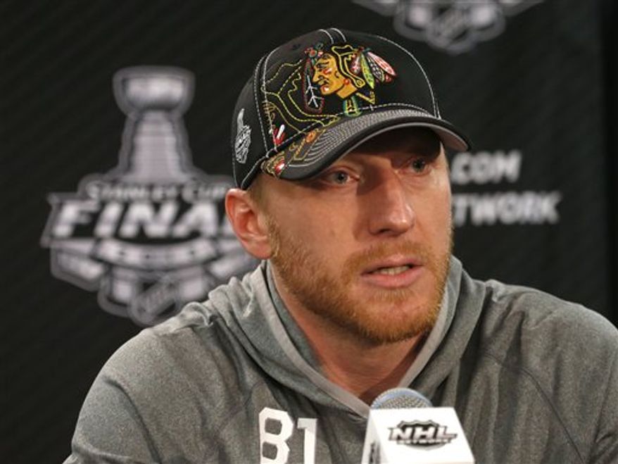 Chicago Blackhawks right wing Marian Hossa responds to a question during an NHL Stanley Cup Final hockey series news conference Thursday, June 13, 2013 in Chicago. The Blackhawks lead the best-of-seven series 1-0 and will face the Boston Bruins in Game 2 on Saturday. (AP Photo/Charles Rex Arbogast)