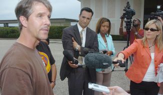**FILE** Chris Simcox, the president of the Minuteman Civil Defense Corps, addresses the media at West Houston Airport on Aug. 14, 2005, regarding the issue of border patrols and their training and tactics. (Associated Press)