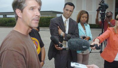 **FILE** Chris Simcox, the president of the Minuteman Civil Defense Corps, addresses the media at West Houston Airport on Aug. 14, 2005, regarding the issue of border patrols and their training and tactics. (Associated Press)