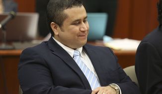 ** FILE ** George Zimmerman smiles as attorney Mark O&#39;Mara questions potential jurors for Zimmerman&#39;s trial in Seminole circuit court in Sanford, Fla., on June 20, 2013. (Associated Press/Orlando Sentinel)