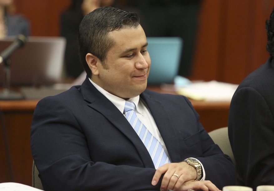 ** FILE ** George Zimmerman smiles as attorney Mark O'Mara questions potential jurors for Zimmerman's trial in Seminole circuit court in Sanford, Fla., on June 20, 2013. (Associated Press/Orlando Sentinel)