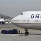 ** FILE ** United Airlines planes taxing at San Francisco International Airport in San Francisco, Feb. 23, 2013. (AP Photo/Eric Risberg, File)